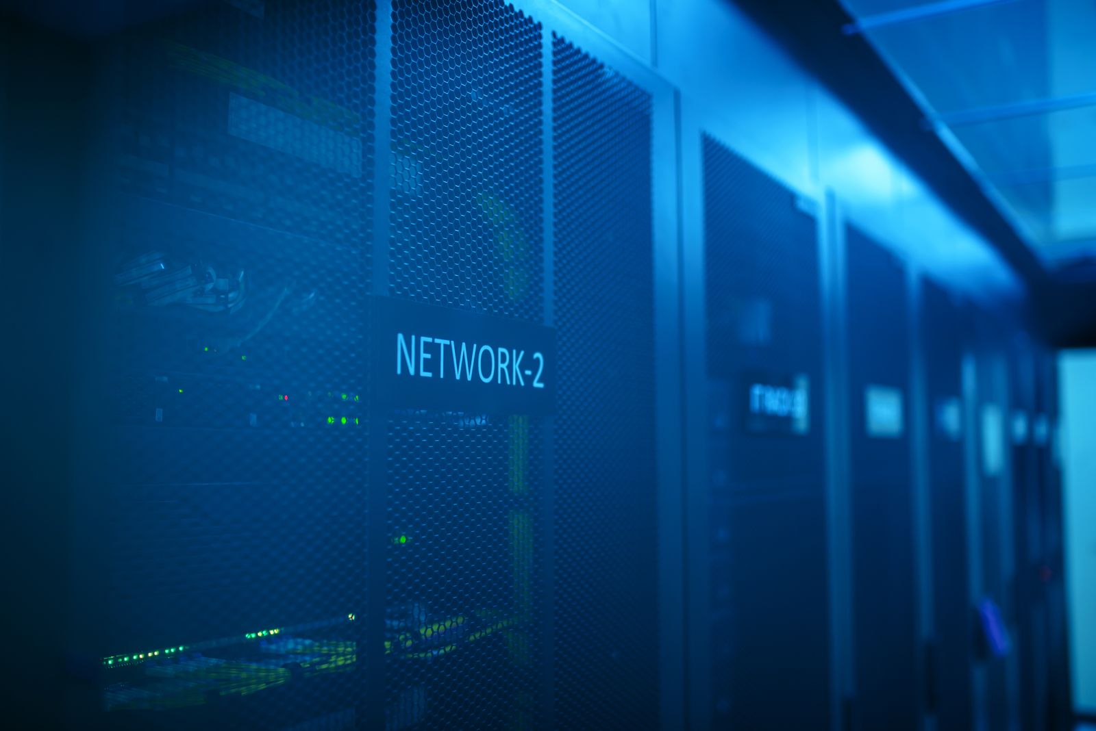 Modern data center corridor with blue illumination
